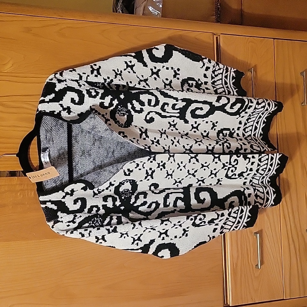 Black and white open front cardigan sweater in size Small.